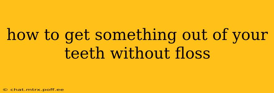 how to get something out of your teeth without floss